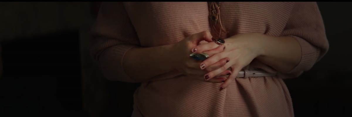 Close view of the ECM director's clasped hands