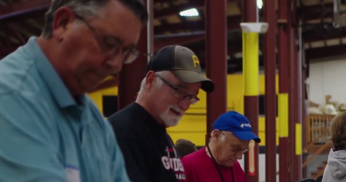 Volunteers pack aid at a long table