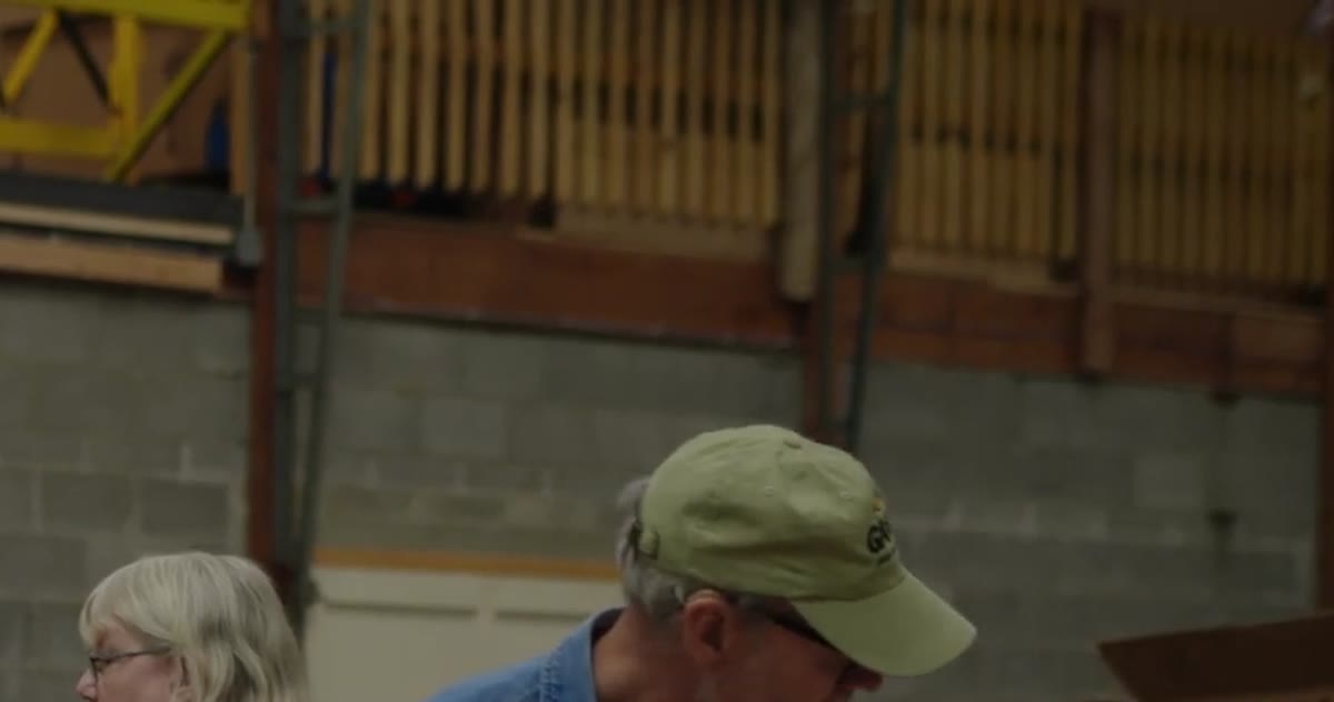 Volunteers in a warehouse aisle